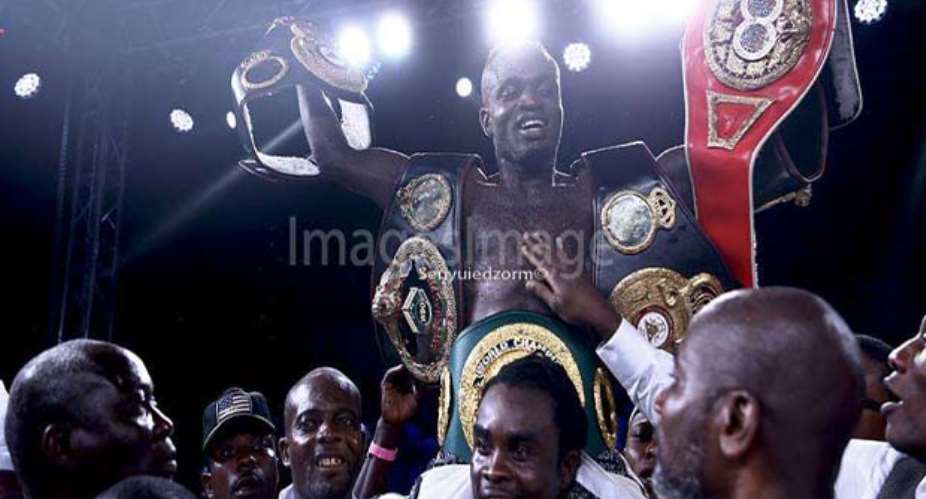 Tagoe carried shoulder high after he was decorated with the new belt