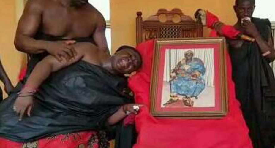 A mourner being consoled