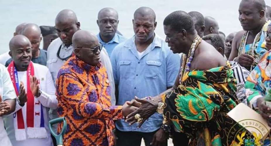 President Akufo-Addo, left, in a handshake with a chief from Ningo-Prampram