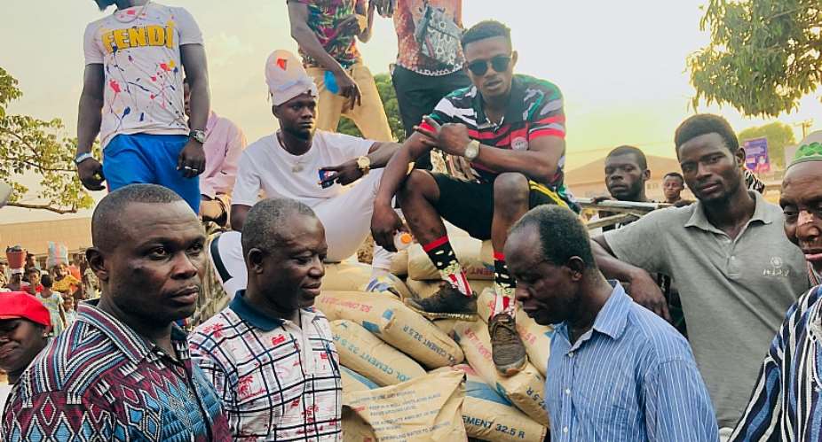 Hon. Joseph Kwasi Mensah presents 50 bags of cement to Dromankese