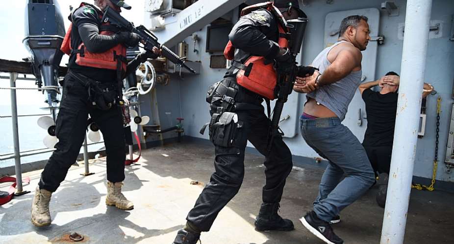 Nigerian Navy Special forces pretend to arrest pirates during a joint military exercise with the French navy. - Source: Photo by Pius Utomi EkpeiAFP via Getty Images