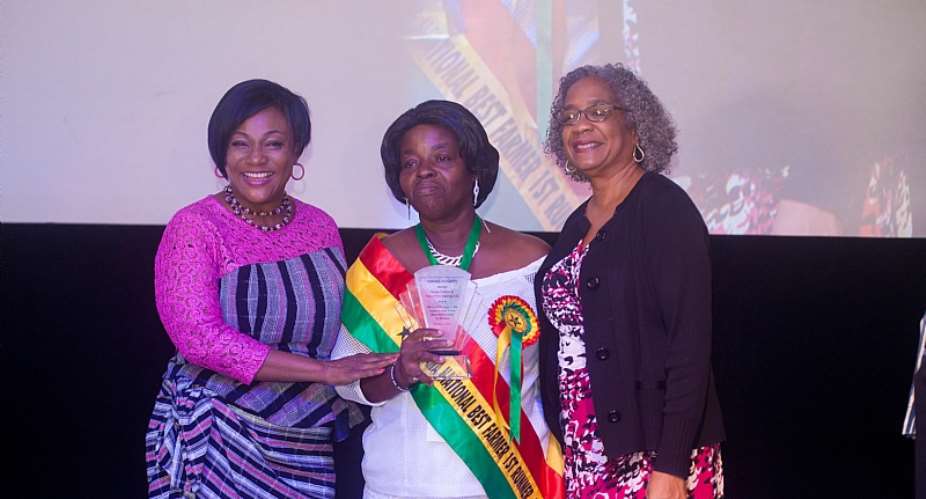Minister of Gender, Children and Social Protection, Honorable Otiko Afisa Djaba left and USAIDGhana Mission Director, Sharon L. Cromer right pose with Mabel-Ann Akoto-Kwudzo center, who was awarded the first runner up—National Best Farmer for 2017 at a Women in Agribusiness Summit hosted by the United States Agency for International Development USAID and MEL Consulting Limited. Photo Credit: USAID Financing Ghana Agricultural Project