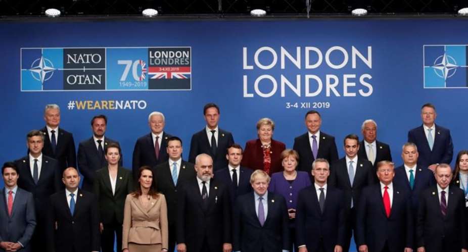 NATO leaders pose for a photo during the summit at the Grove Hotel in Watford, northeast of London on December 4, 2019 Christian HartmannPoolAFP