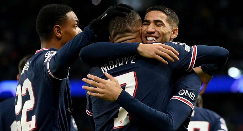 Paris Saint-Germain's French forward Kylian Mbappe C is congratulated by team mates after scoring a goal during the UEFA Champions League first round day 6 Group A football match between Paris Saint-Germain PSG and Club Brugge, at the Parc des PrincesImage credit: Getty Images