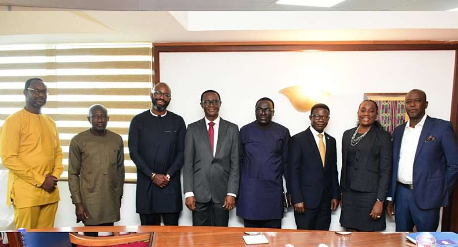 Ralph Mupita and MTN Ghana in a pose with the Governor Dr. Ernest Addisson, deputies and other members of the delegation