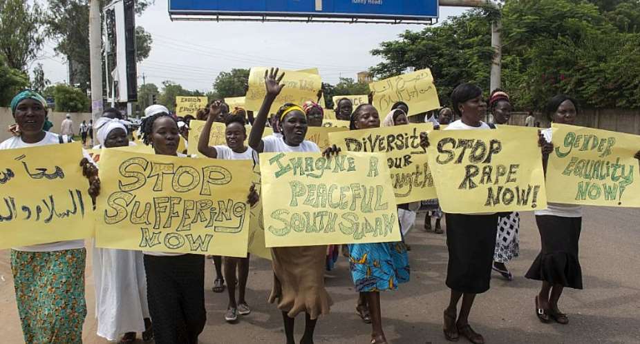 Women march with placards calling for peace and their rights on the streets of South Sudanamp;39;s capital, Juba, in 2018. - Source: BULLEN CHOLAFP via Getty Images