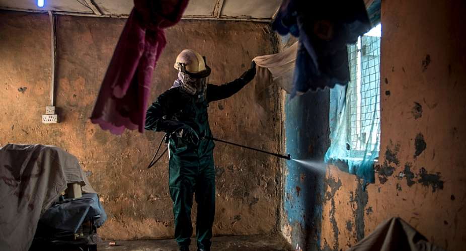 Indoor residual spraying is one of the main components of malaria control.   - Source: Cristina AldehuelaAFP via Getty Images