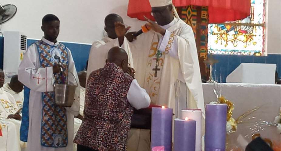 The President being prayed for by Most Rev. Bonaventure Kwofie