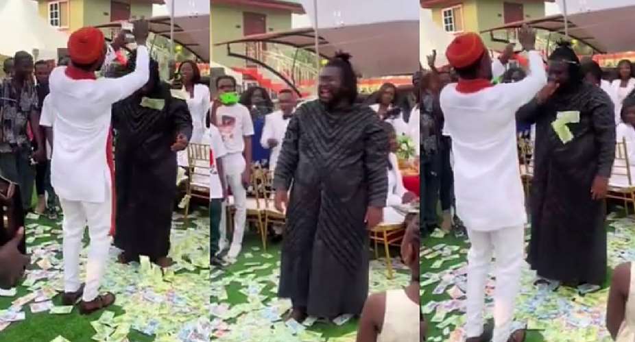 Prophet Ogyaba spray bundles of cash on Ajagurajah during birthday ceremony