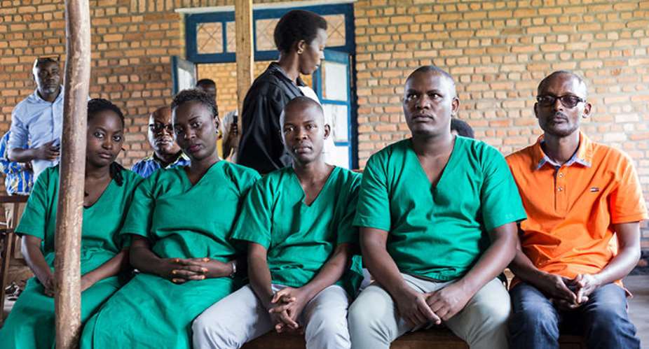 Four journalists from Burundian news outlet Iwacu from left Agnes Ndirubusa, Christine Kamikazi, Terence Mpozenzi, and Egide Harerimana--and their driver Adolphe Masabarakiza--appear at the High Court in Bubanza, western Burundi, on December 30, 2019, charged with undermining state security. AFPTchandrou Nitanga