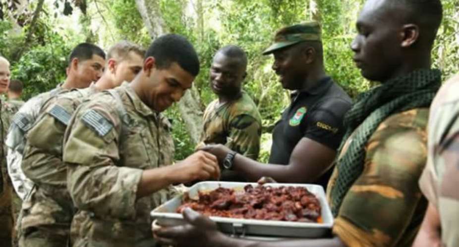 Viral Photos: US Soldiers Eating Python Meat In Ghana