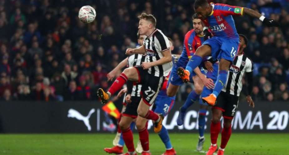Substitute Jordan Ayew headed in a later winner to deny Grimsby a third round replay