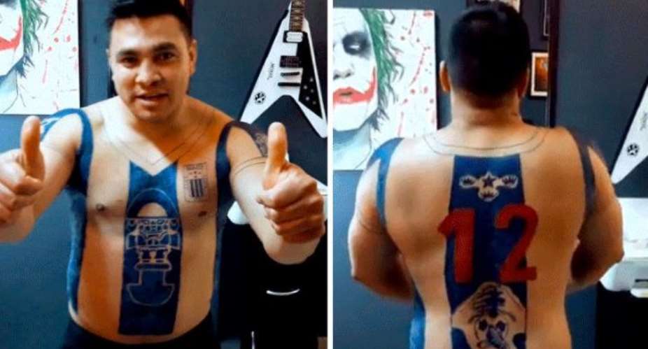 Football fan spends 60 hours on favorite team's jersey tattooed on his body