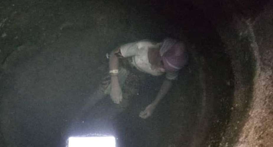 The dead woman floating in the water in the well