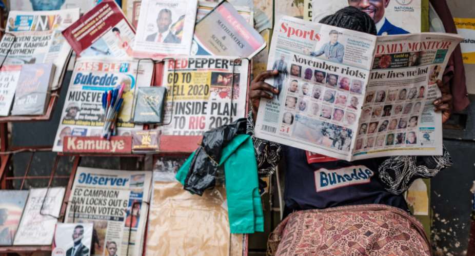 Newspapers covering upcoming elections are seen in Kampala, Uganda, on January 4, 2021. Security forces have harassed and detained journalists covering opposition candidates in the election. (AFP/Sumy Sadurni)