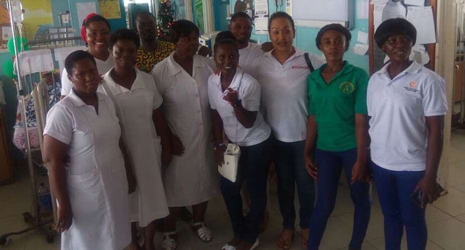 The Actress takes a pose with the nurses