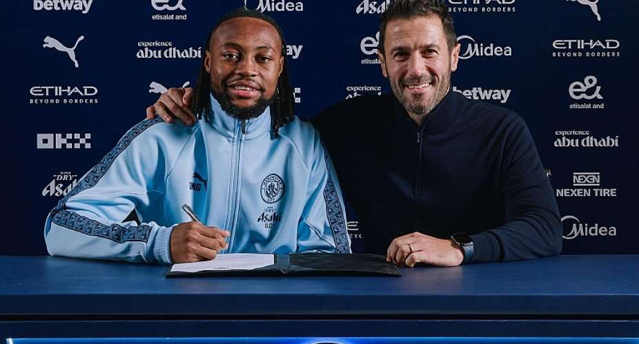 Manchester CityImage caption: Antoine Semenyo (left) posed for a signing photo with Manchester City sporting director - and former Newcastle and Portugal midfielder - Hugo Viana
