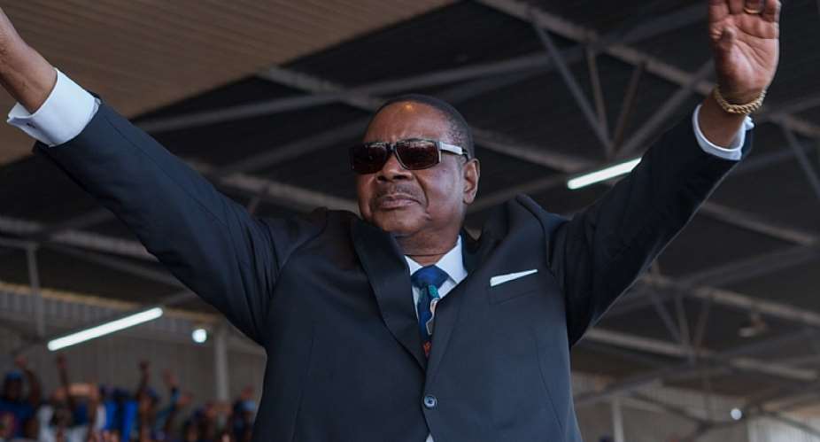 Malawi&#39;s President elect Peter Mutharika waves to supporters during the swearing in ceremony  in Blantyre in May last year after the contentious poll. - Source: AMOS Gumulira/AFP via Getty Images