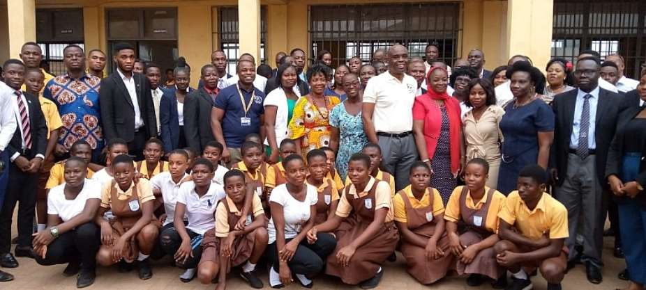 A group photograph of management and students of UPSA and La-Nkwantanang Basic School