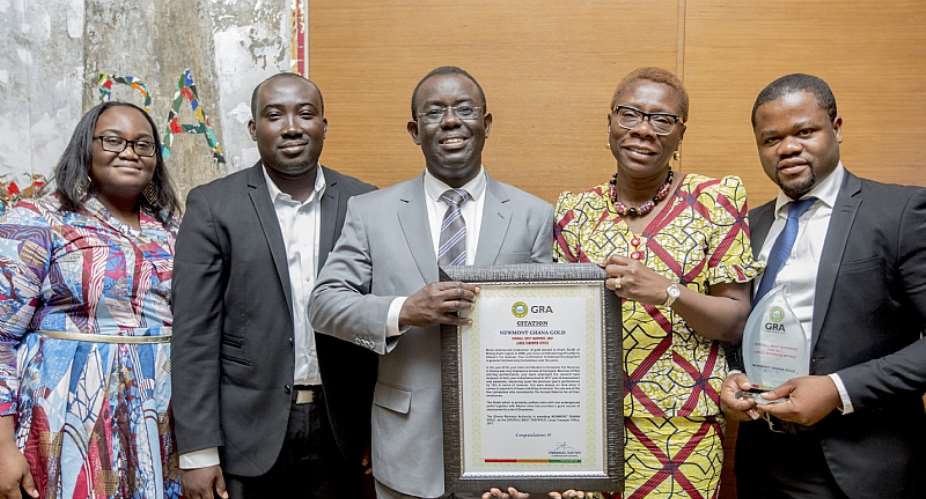 Kwame Addo-Kufuor, Regional Chief Financial Officer, Newmont Africa Middle and Adiki Ayitevie, Snr Director Communications and External Relations, Newmont Africa with the citation