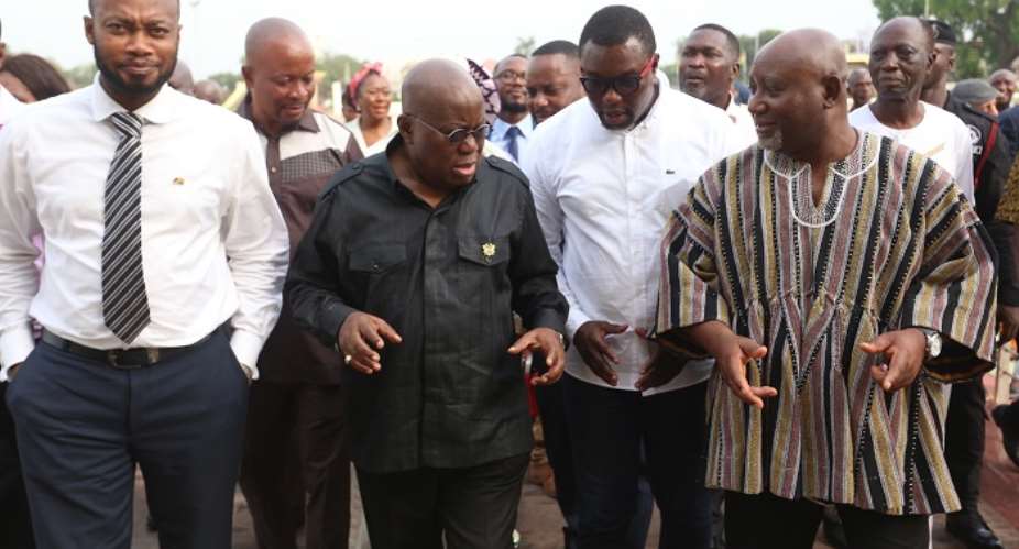 President Akufo-Addo interacting with Davis Nard Korboe 2nd right, Chiarman, National Farmers and Fishermen Award Winners with some executives with them