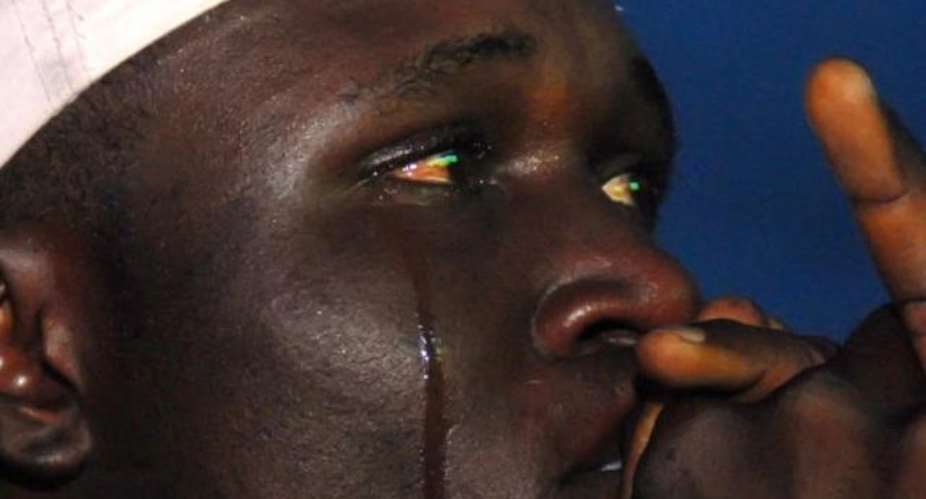 GETTY SEGUN OGUNFEYITIMIImage caption: This Nigerian fan was inconsolable after the defeat in the final