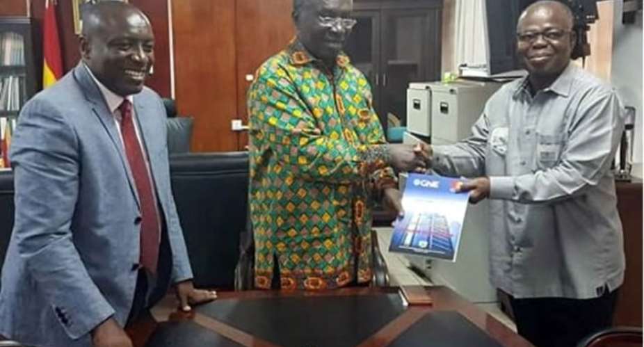 Ing. Kwabena Agyei Agyepong, Executive Director of GhIE L Ing. Steve Amoaning-Yankson, President of GhIE right, presents the document to Professor Kwabena-Frimpong Boateng,