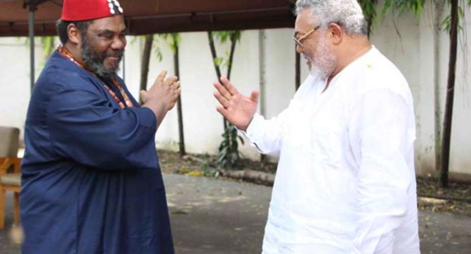 President Jerry John Rawlings and Pete Educhie in a handshake