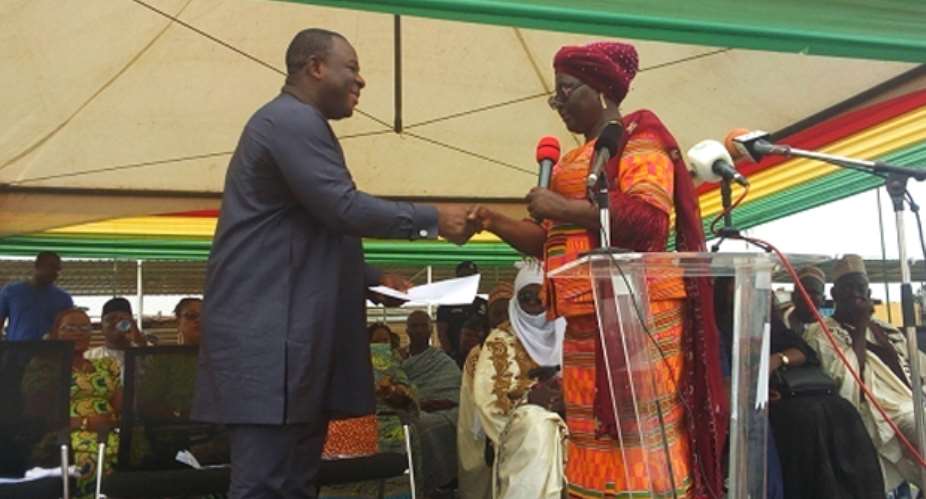 Dr Lord Commey in handshake with Hajia Alima Mahama