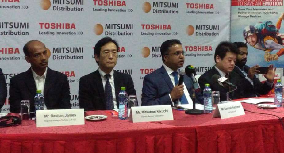 Santosh Varghese middle, flanked by other officials of Toshiba, addressing journalists