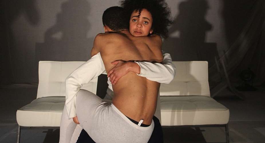 Buhle Ngaba as The Student holds Shaun Oelf as The Dancer. - Source: Yazeed Kamaldien/What Remains