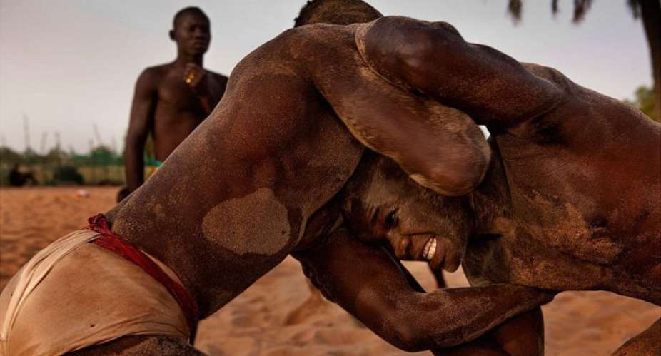 Senegalese wrestlers in action. Photo by Getty Images. - Source:
