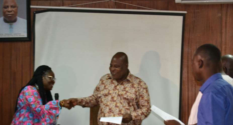 Mr Ashitey in a handshake with Afoley Quaye