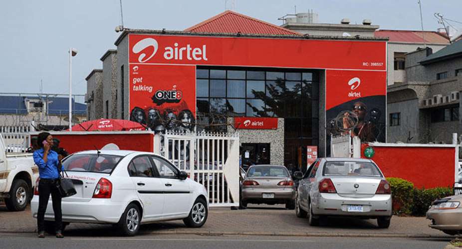 A woman makes a phone call in front of India-owned Airtel on October 10, 2011 in Abuja. A Nigerian NGO on February 25, 2020, sued the Nigerian Communications Commission over warrantless access to 'call data.' AFPPius Utomi Ekpei