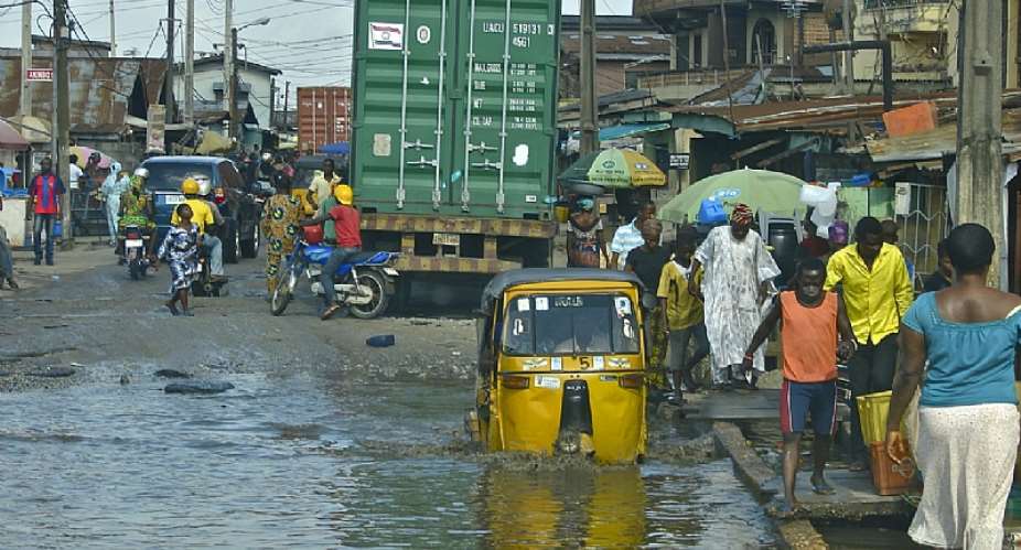 A flooded street in Lagos, Nigeria - Source: Wikimedia Commons