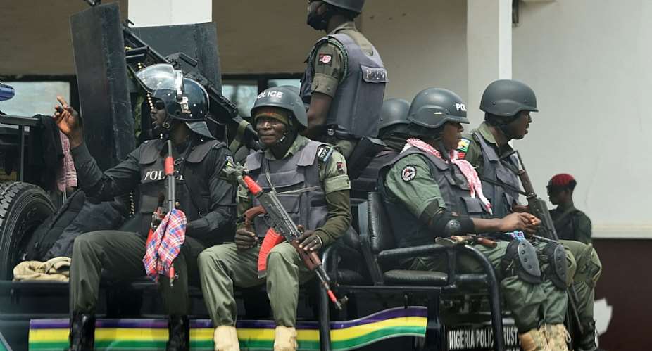 Armed policemen patrol ahead of the last governorship election in Anambra state, southeast Nigeria.  - Source: Pius Utomi EkpeiAFP via Getty Images