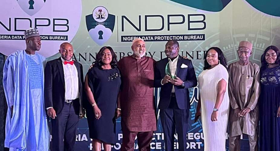 Nigeria Digital ID4D project Coordinator, Odole Solomon 4th R and other project team members posing for a photograph with the Chairman, African Union Cybersecurity Expert Group, Mr. Abdulhakeem Ajijola 4th Lafter receiving the Award