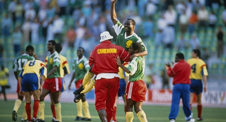 Cameroon's Roger Milla held aloft at the 1990 FIFA World Cup in Italy. - Source: RENARD eric/Corbis via Getty Images