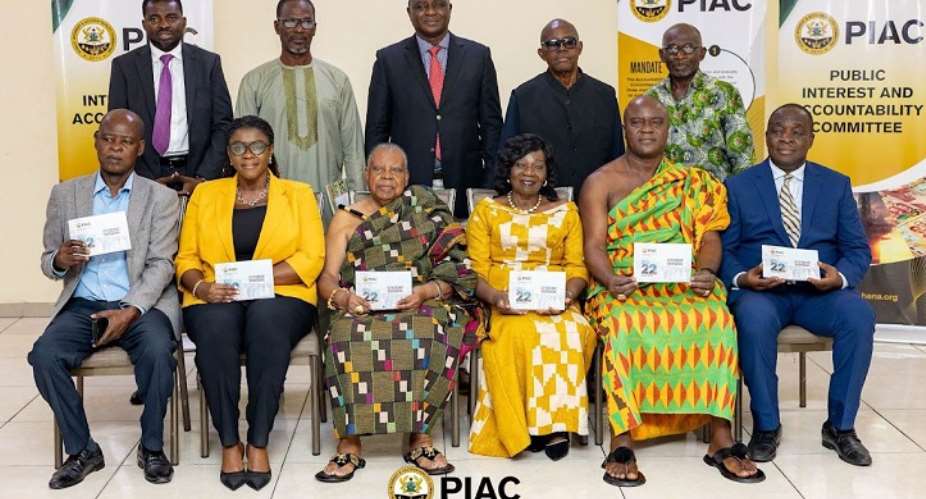 Dignitaries displaying the PIAC report at the launch