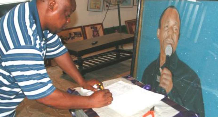 Evangelist Eze signing a condolence register at the late Sonny Okosuns’ Ogba residence