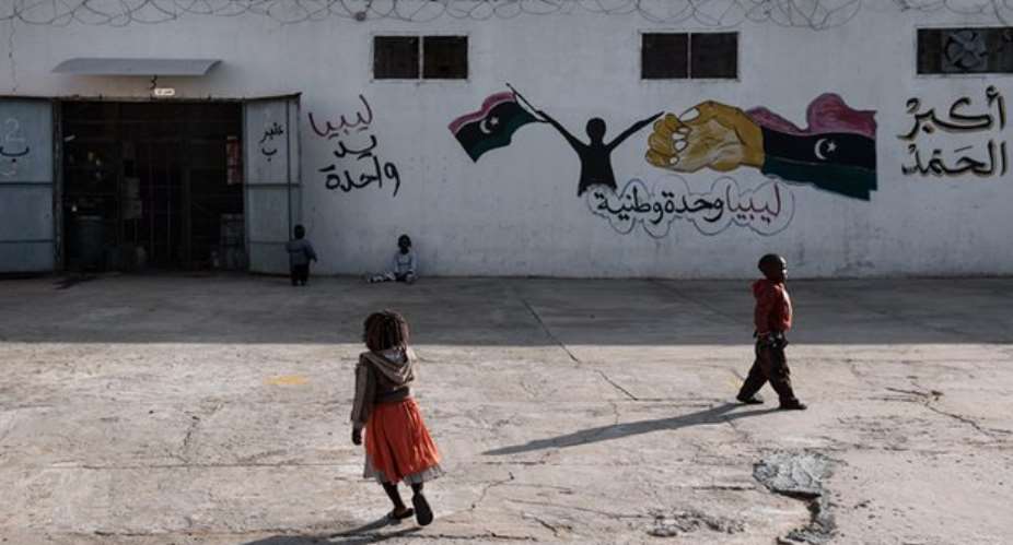 Children outside a government-run detention centre in Libya. Photograph: RomenziUnicef