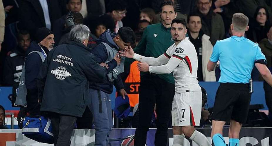 Getty ImagesImage caption: Pedro Neto pushed over a ball boy after Paris St-Germain scored their fourth goal