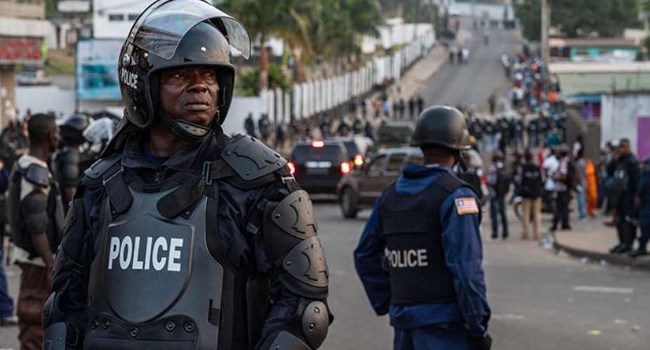 Police are seen in Monrovia, Liberia, on January 6, 2020. Police recently arrested journalist Kaluba Akoi over his Facebook posts. AFPCarielle Doe