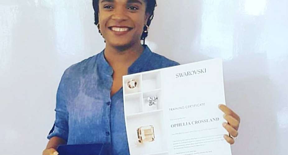 Ophelia Crossland displays an award from Swarovski