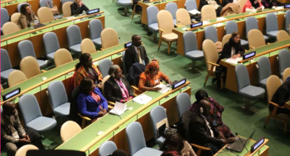 Picture by R. Harry Reynolds shows Ms. Otiko Djaba in kente cloth reading her address at the UN General Assembly.