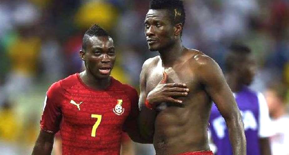 Asamoah Gyanbearchested and Christian Atsu in their Black Stars days