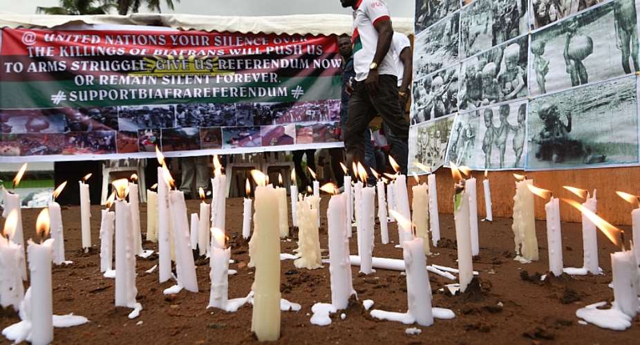 Banners and candles are displayed during a ceremony commemorating the Biafran War  - Source: