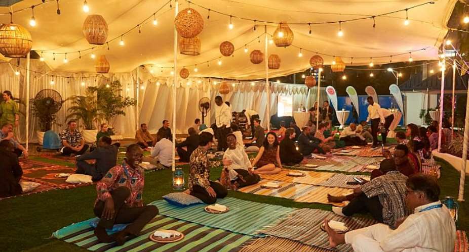 Caption: The audience dine on mats Photo:  FAO