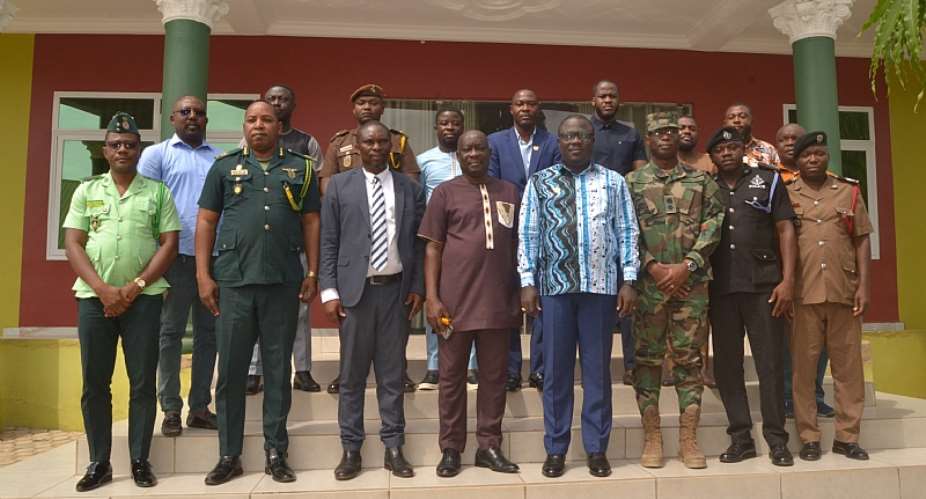 Bono Regional Minister in picture with security officials