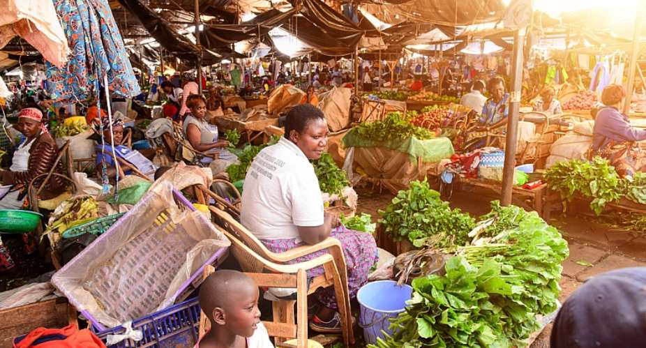 Vendors in a market - Source: Billy MiaronShutterstock